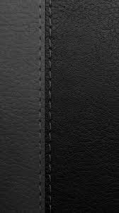 Two pieces of real leather side by side one grey and the other black.